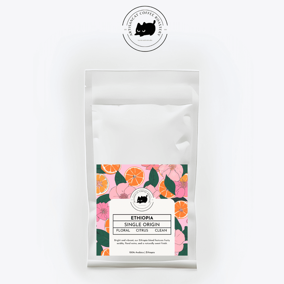 Ethiopia coffee bag with a label of pink blossoms, orange slices and green leaves